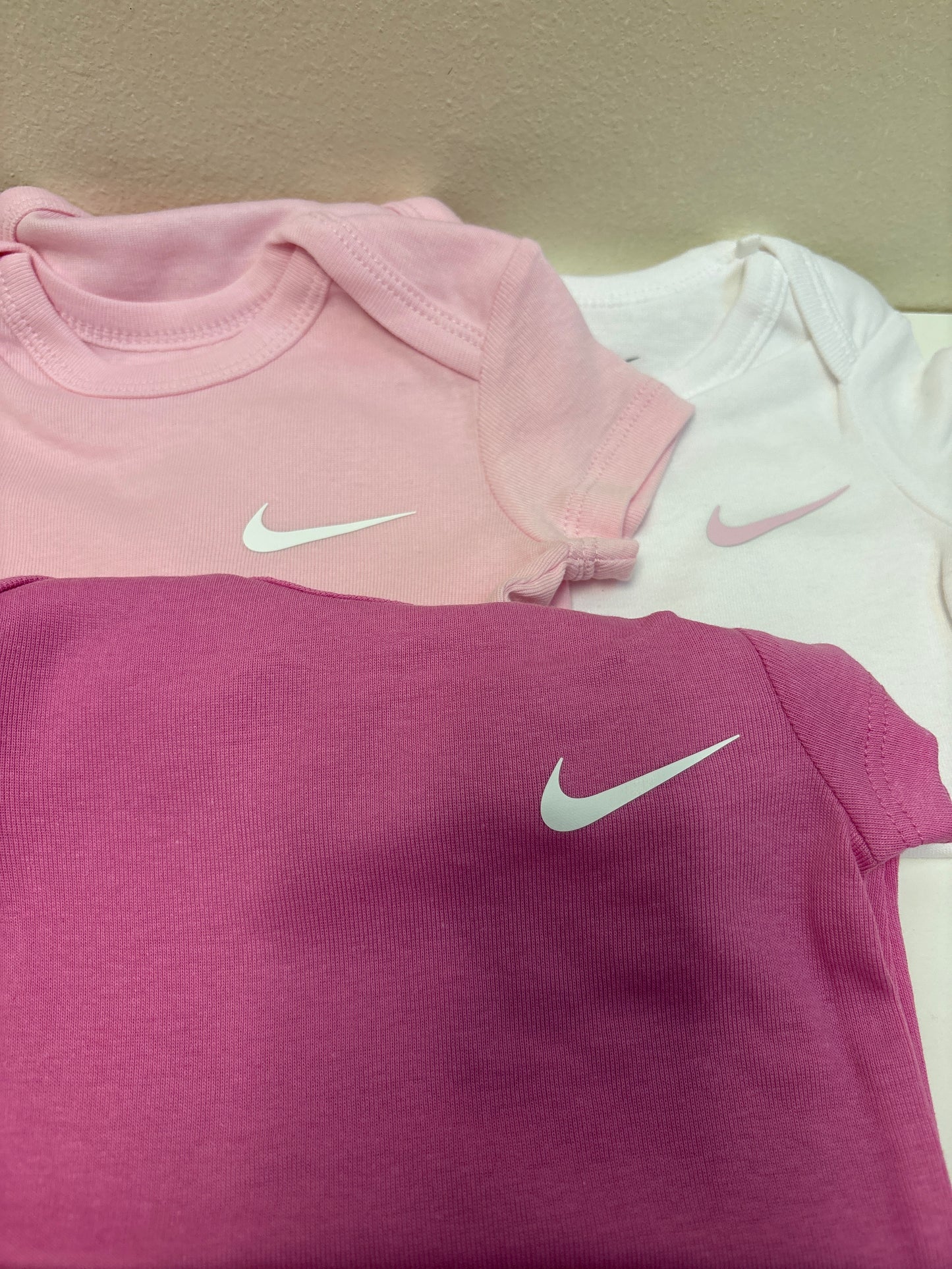 6m New Pink Nike Onesies (3 Pack)