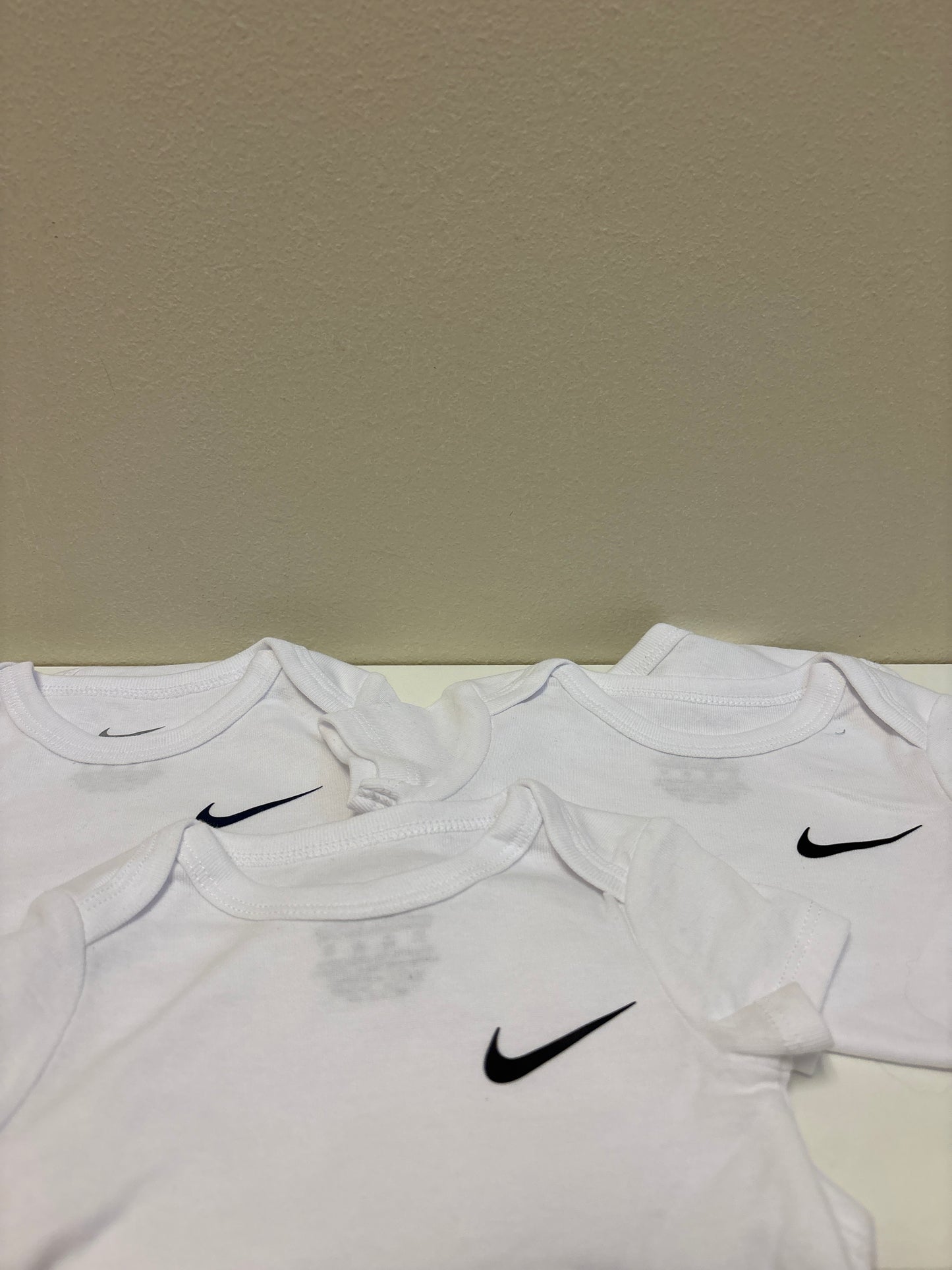 6m New White Nike Onesies (3 Pack)